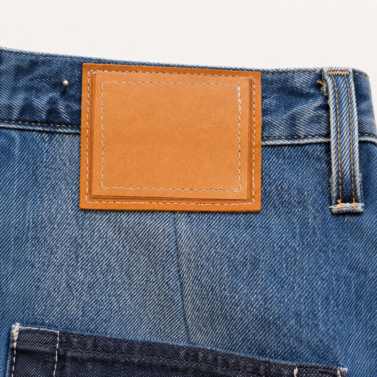Victor-Hart upcycled straight leg pants, fabric detail showing upcycled denim texture